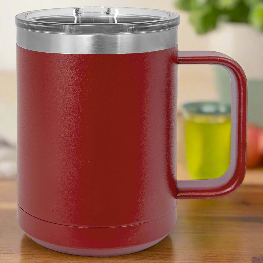Red insulated mug with a silver lid on a 