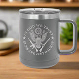Gray insulated mug with 'In God We Trust' and 'Guns Are Just Backup' text 